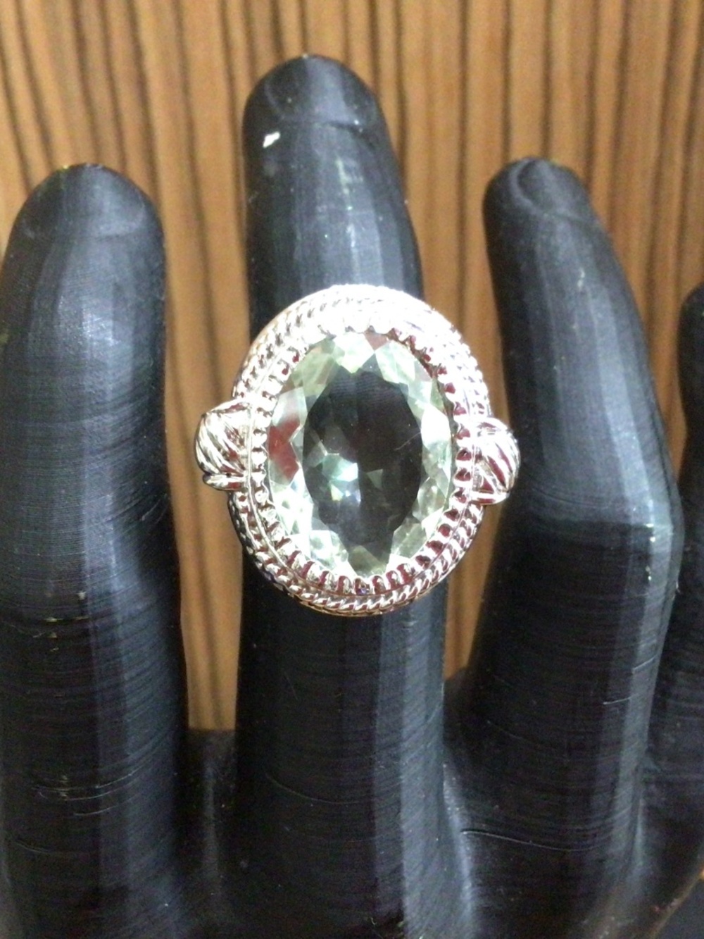 925 stamped sterling silver ring with large light green stone. Size 7.5